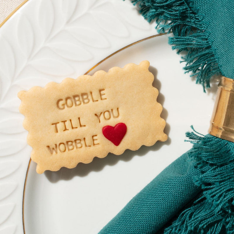 Gobble till you wobble message shortbread cookie with a red sugar sprinkle for Thanksgiving gift and hostess gift 