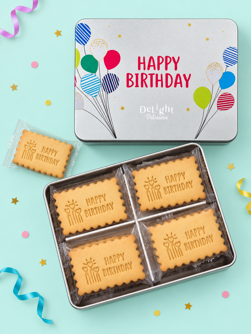 Happy Birthday cookie tin decorated with colorful balloons and golden stars, filled with shortbread cookies stamped “Happy Birthday” and heart-shaped candles - a thoughtful birthday gift