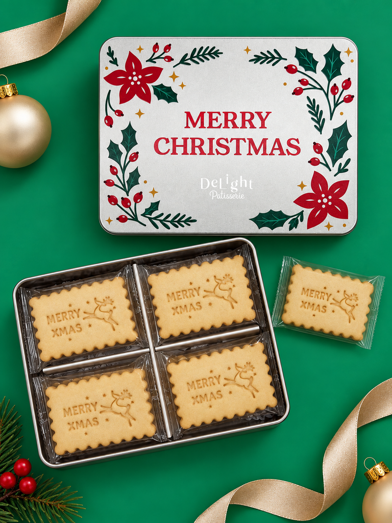 Merry Christmas shortbread cookie tin decorated with poinsettias, holly, and red berries, filled with individually wrapped shortbread cookies stamped “Merry Xmas,” reindeer, and stars—a festive Christmas gift.