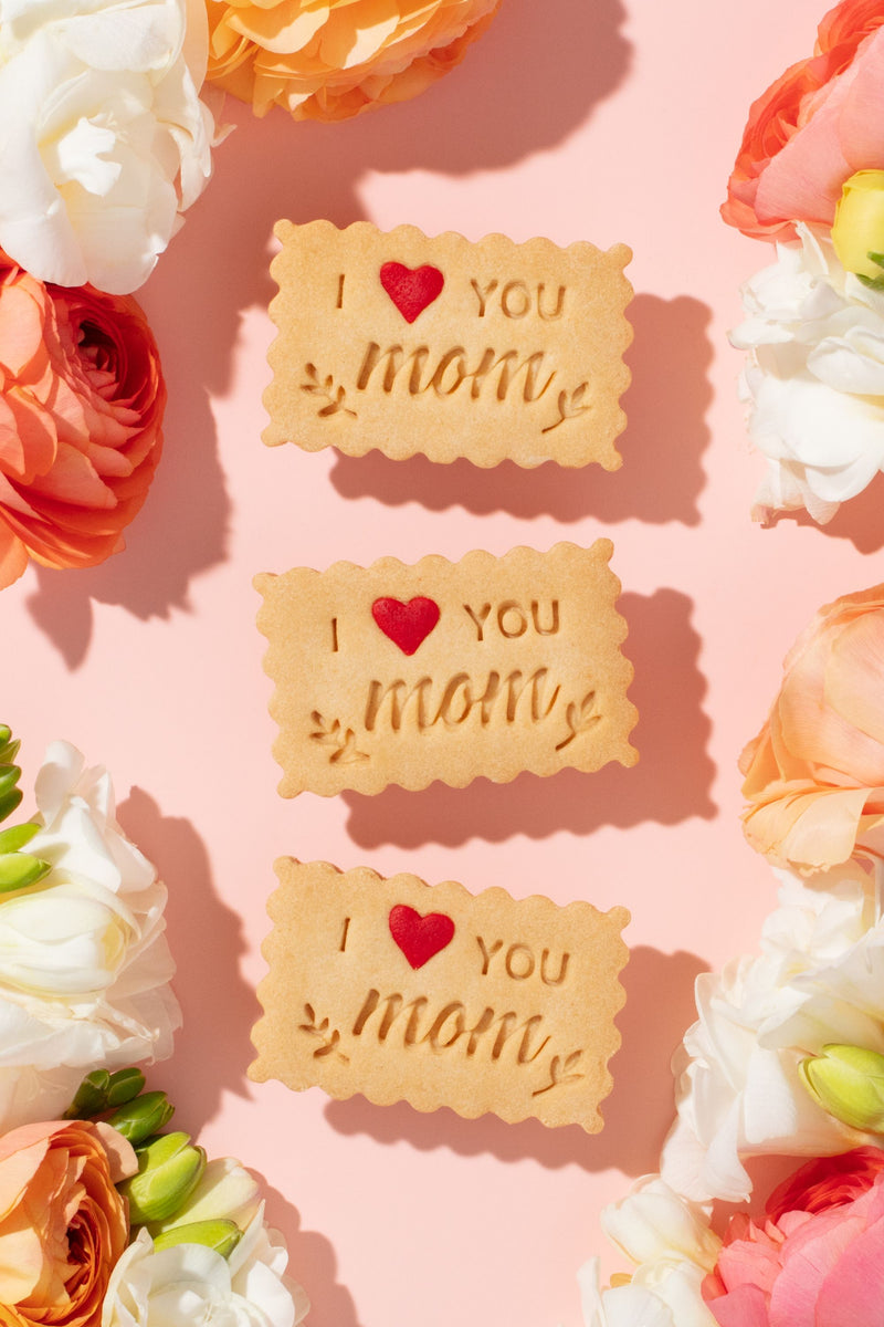 I LOVE YOU MOM shortbread cookie with a red sugar sprinkle for mother's day gift