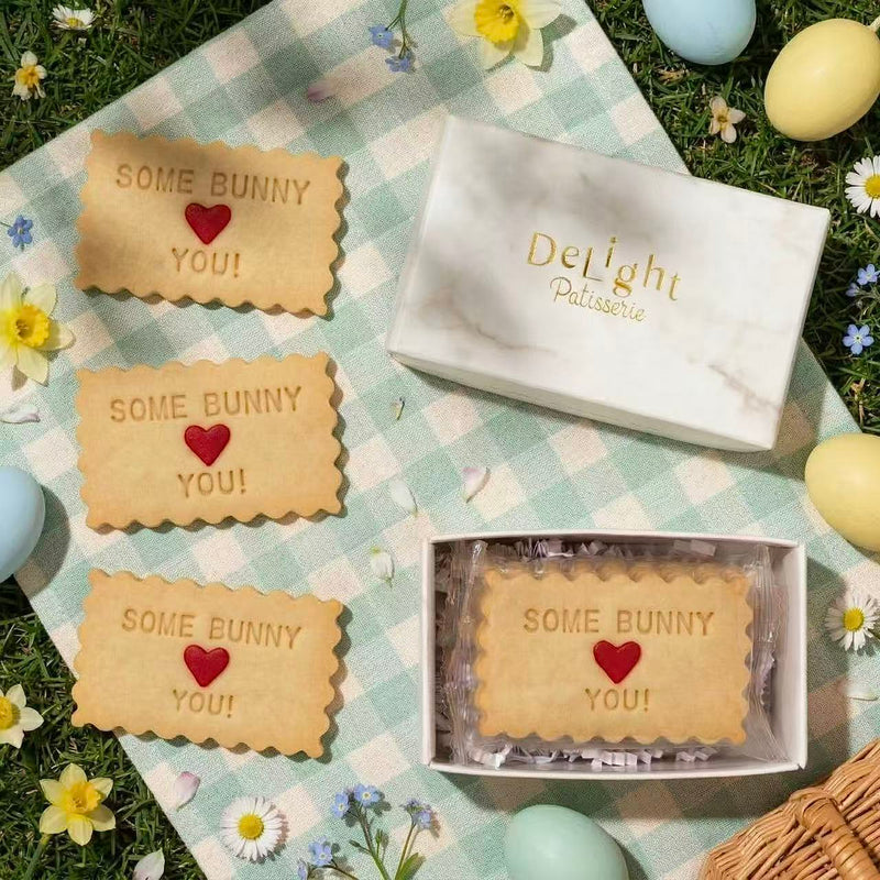 Easter-themed shortbread cookies with 'Some Bunny You!' in white marble gift box