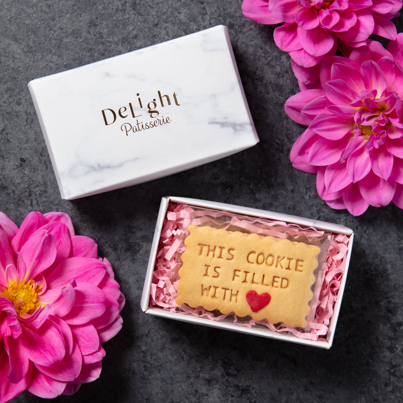 This Cookie is Filled With Love shortbread cookies with red heart sprinkle close-up for valentine's day, anniversary and thinking of you gift