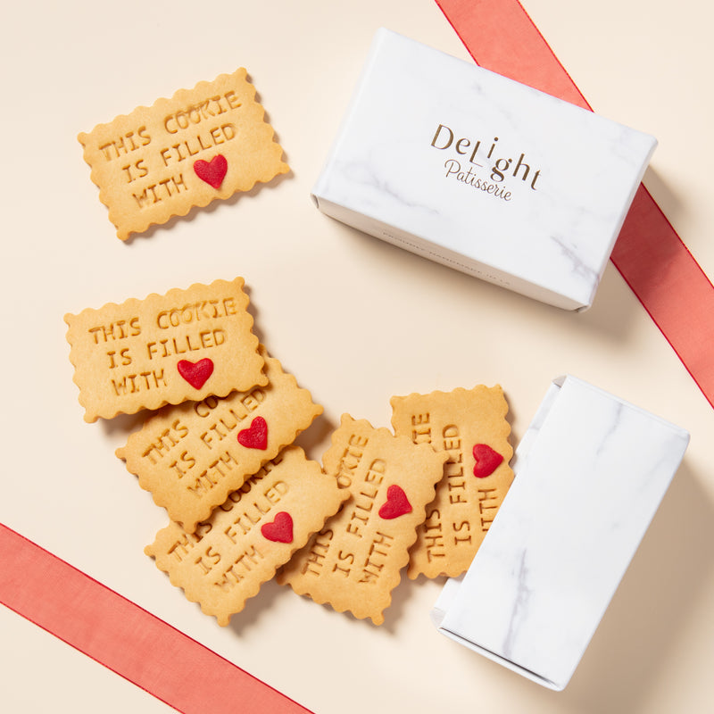 This Cookie is Filled With Love shortbread cookies with red heart sprinkle close-up for valentine's day, anniversary and thinking of you gift