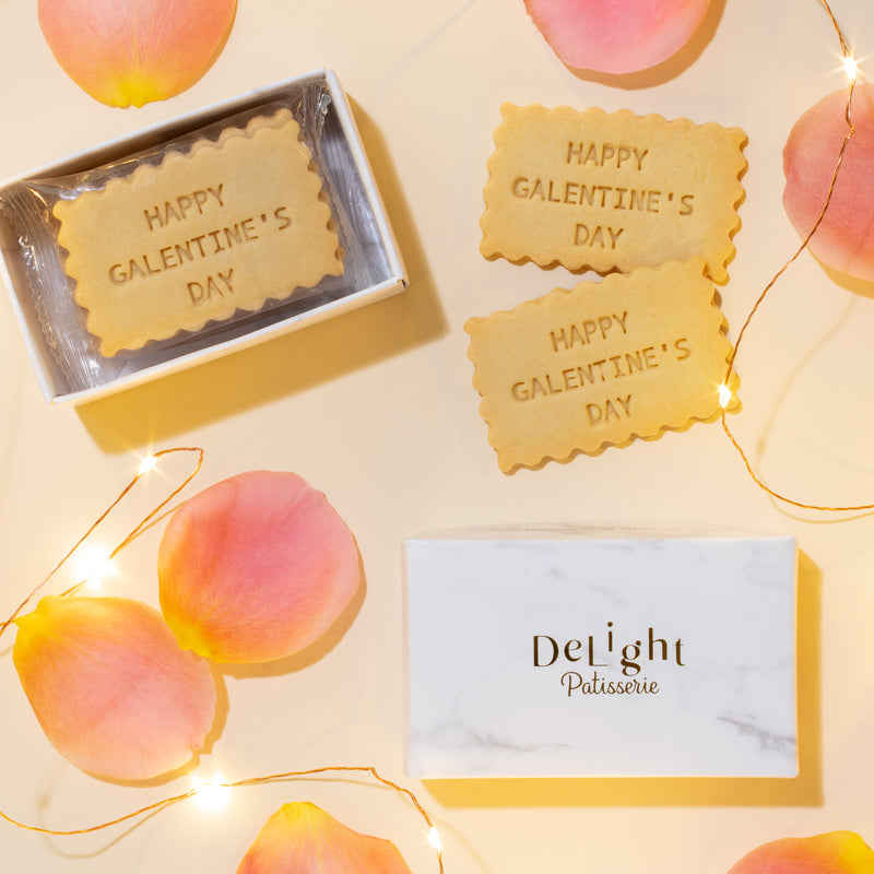 Galentine's Day shortbread cookie gift box with stamped vanilla cookies in white marble packaging