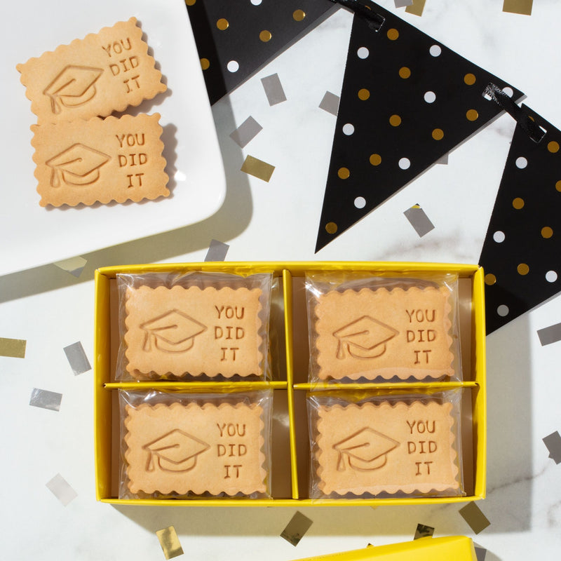 Graduation shortbread cookies with You Did It message and cap design in yellow gift box, Perfect gifts & party favors to celebrate.